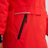 Manteau pour femme de couleur rouge. Bande réfléchissante aux poches.